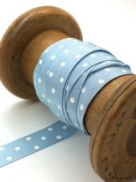 A vintage style, pale blue ribbon with white polka dots