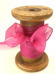A bright pink , chiffon ribbon, perfect for making bows and wrapping gifts.